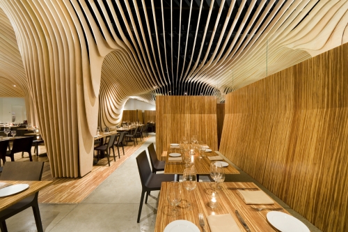 Banq Restaurant - wood slatted ceiling design by Nadaaa